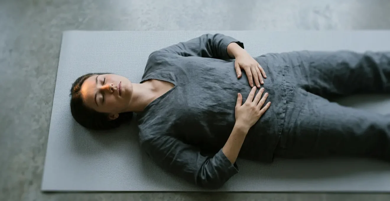 Person lying in savasana with subtle visual representation of the transitional state between wakefulness and sleep